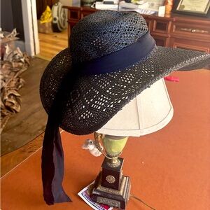 Black straw rimmed hat with black ribbon